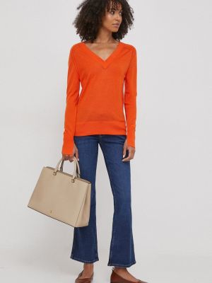 Sweter wełniany Calvin Klein pomarańczowy