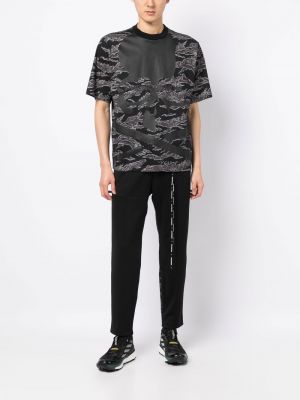 Pantalon de joggings à imprimé à imprimé camouflage Mastermind World noir