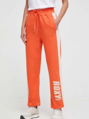 Spodnie sportowe bawełniane z nadrukiem Roxy pomarańczowe