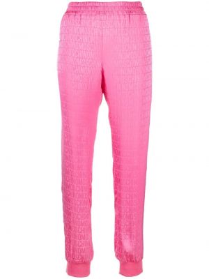 Spodnie sportowe z nadrukiem Moschino różowe