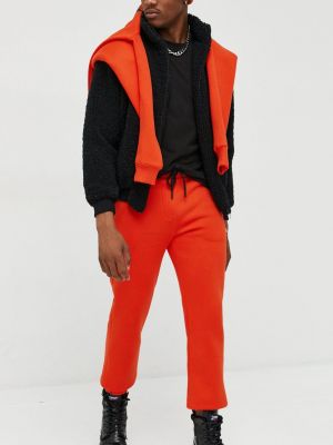Однотонні спортивні штани Kangol помаранчеві