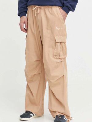 Jednobarevné bavlněné kalhoty Karl Kani béžové