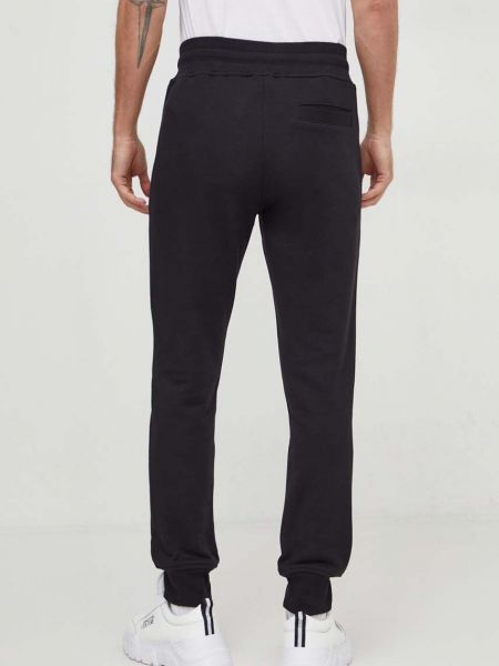 Bavlněné sportovní kalhoty s aplikacemi Versace Jeans Couture černé