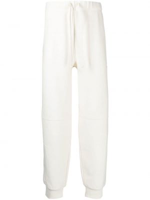 Bavlnené teplákové nohavice Carhartt Wip biela