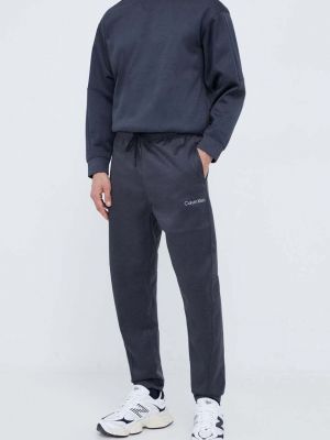Melanžové kalhoty Calvin Klein Performance