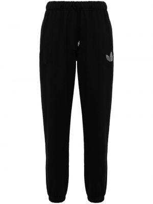 Bavlnené džerzej pruhované teplákové nohavice Adidas čierna