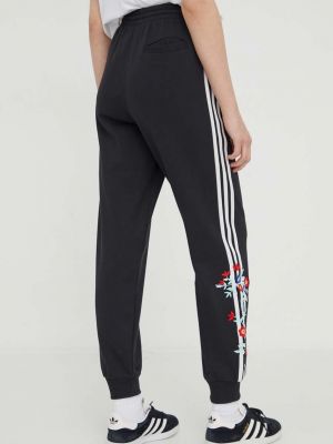 Bavlněné sportovní kalhoty s aplikacemi Adidas Originals černé