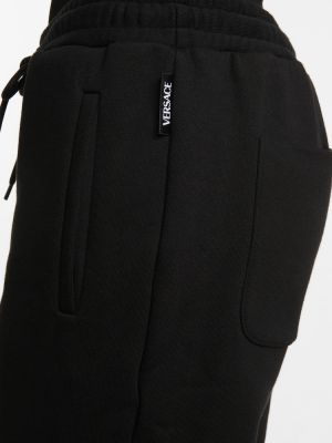 Bavlnené teplákové nohavice Versace čierna