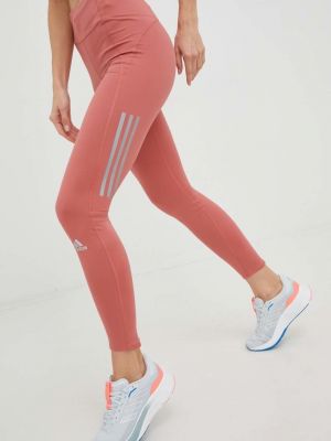 adidas Performance legginsy do biegania Own the Run Winter damskie kolor pomarańczowy z nadrukiem