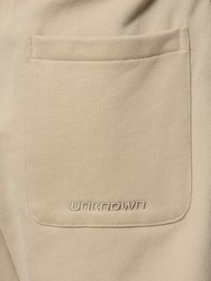 Běžecké kalhoty Unknown béžové
