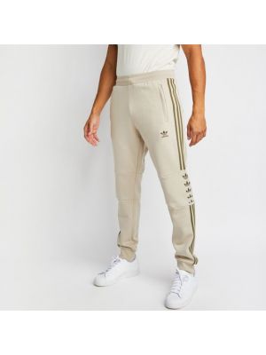 Pantaloni a righe Adidas beige