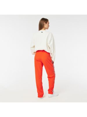 Спортивные штаны Lacoste оранжевые