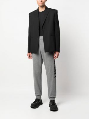 Slim fit sportovní kalhoty s potiskem Versace šedé