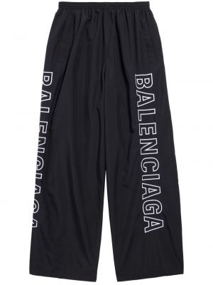 Voľné teplákové nohavice s potlačou Balenciaga