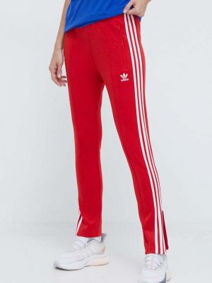 Červené sportovní kalhoty s aplikacemi Adidas Originals