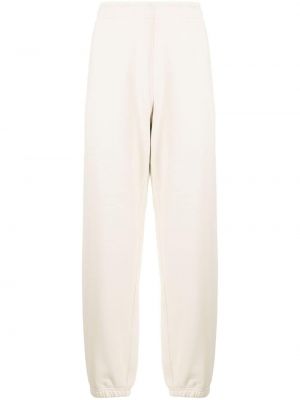 Pantalon de joggings en coton avec applique Stone Island blanc