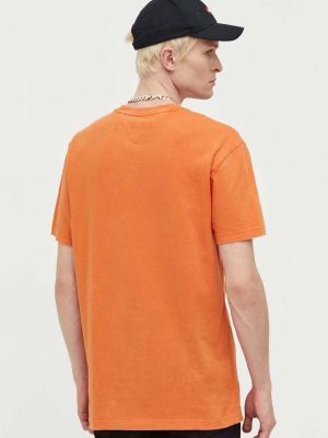 Bavlněné tričko Tommy Jeans oranžové