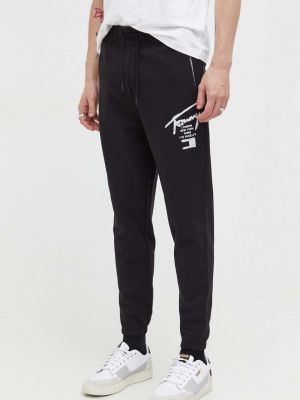 Bavlněné sportovní kalhoty s potiskem Tommy Jeans černé