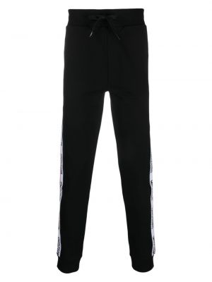 Pantaloni din bumbac cu imagine Moschino negru