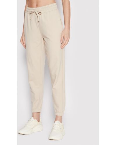 Outhorn Pantaloni trening SPDD606 Bej Relaxed Fit