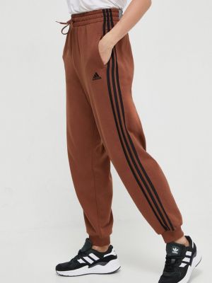 Bavlněné sportovní kalhoty s aplikacemi Adidas hnědé