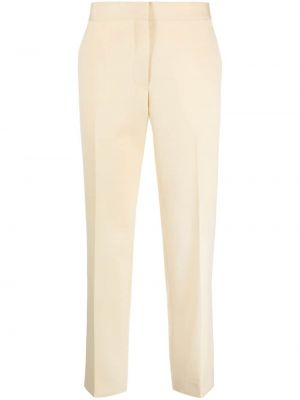 Pantaloni di lana slim fit Jil Sander giallo