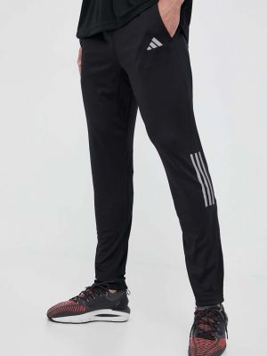 Běžecké kalhoty s potiskem Adidas Performance černé