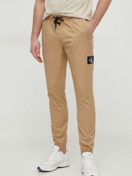 Spodnie dopasowane Calvin Klein Jeans beżowe