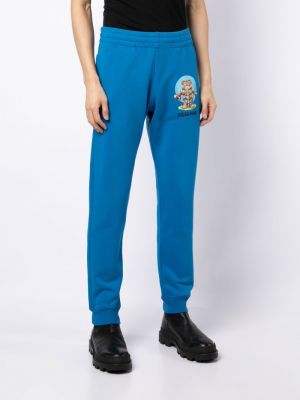 Pantalon de joggings en coton à imprimé Moschino bleu