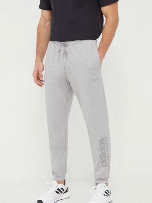 Спортивні штани з принтом Adidas сірі