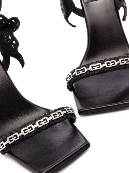 Punutud lahtise kannaosaga sandaalid Givenchy must
