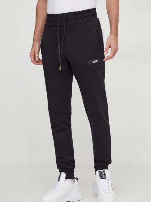 Bavlněné sportovní kalhoty s aplikacemi Versace Jeans Couture černé
