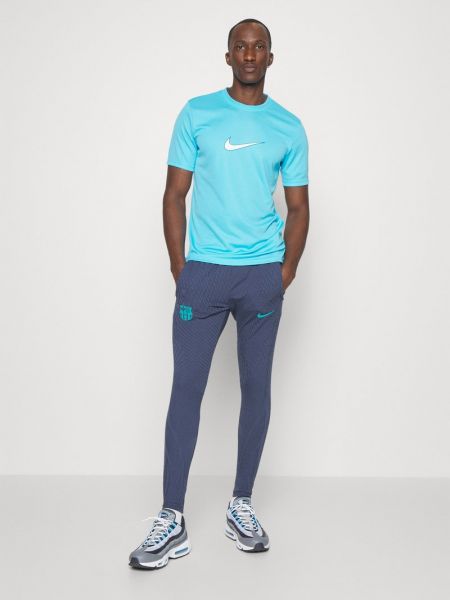 Spodnie sportowe Nike Performance niebieskie