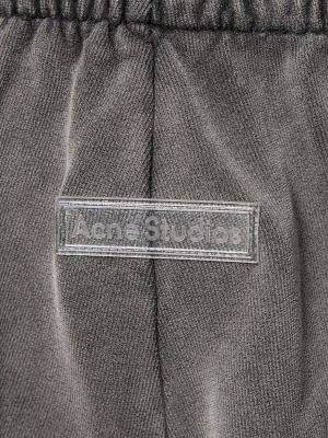 Bavlnené teplákové nohavice Acne Studios hnedá