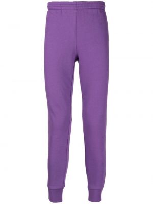 Teplákové nohavice Lacoste fialová