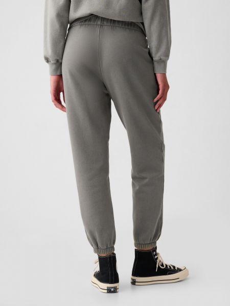 Teplákové nohavice Gap sivá
