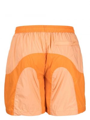 Shorts de sport à imprimé Pleasures orange