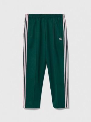 Спортивные штаны с аппликацией Adidas Originals зеленые