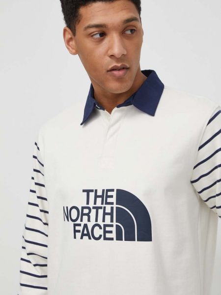 Bavlněné tričko s dlouhým rukávem s potiskem s dlouhými rukávy The North Face béžové