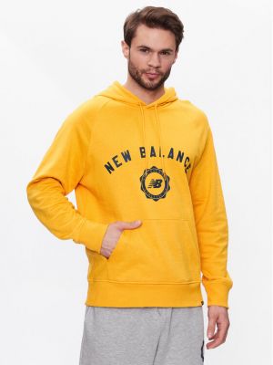Laza szabású pulóver New Balance sárga