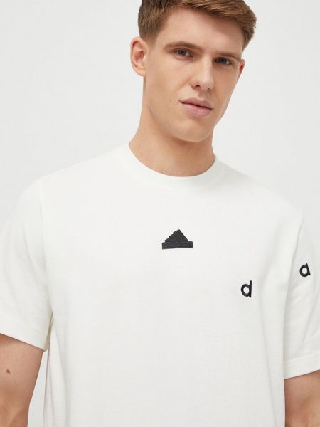 Bavlněné tričko s aplikacemi Adidas béžové