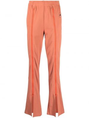 Pantaloni con cerniera con motivo a stelle Adidas By Stella Mccartney arancione
