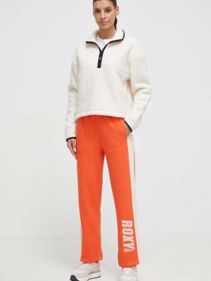 Spodnie sportowe bawełniane z nadrukiem Roxy pomarańczowe
