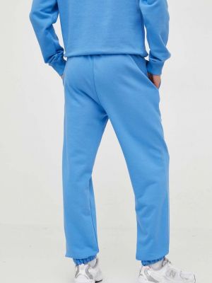 Bavlněné sportovní kalhoty Lacoste modré