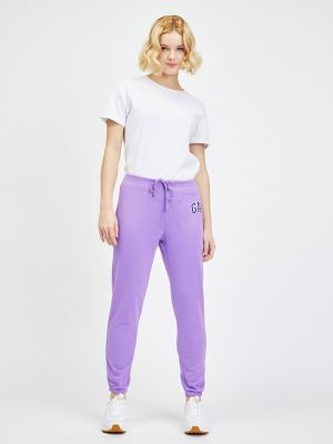 Teplákové nohavice Gap fialová
