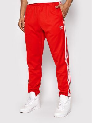 Slim fit priliehavé teplákové nohavice Adidas červená