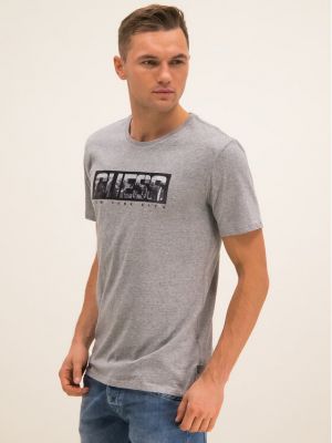 Priliehavé tričko Guess sivá