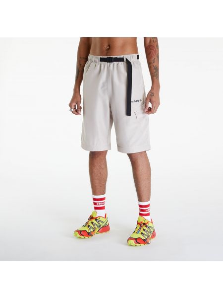 Běžecké kalhoty na zip Adidas Originals béžové