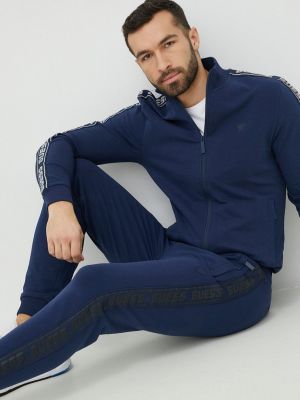 Spodnie sportowe z nadrukiem bawełniane Guess niebieskie