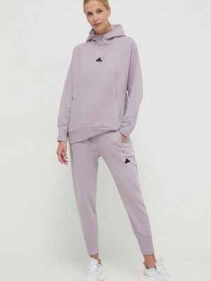 Spodnie sportowe z nadrukiem Adidas fioletowe